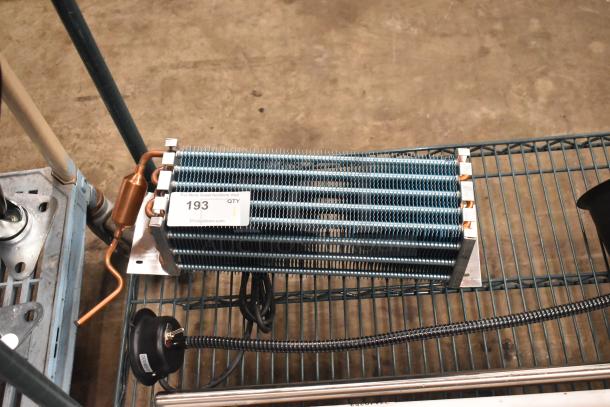 BRAND NEW 6R5K370LAA Evaporator Coil, minor scratches, with visible label "193 QTY 1," copper tubing attached.