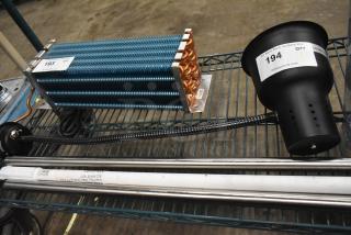 Alt text: Brand new CK7416D0170 warming lamp, 120 volts, 1 phase. Features minor scratches and dents, auction tags visible.