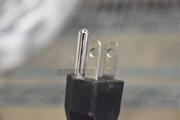 Close-up of a power plug for the CK7416D0170 Warming Lamp, 120 volts, single-phase, with minor surface scratches.