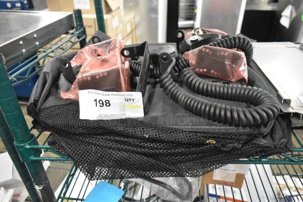 Lot of assorted items including coiled cables, mics, and a hanging holder in mesh bag. Tag label indicates "QTY 198".