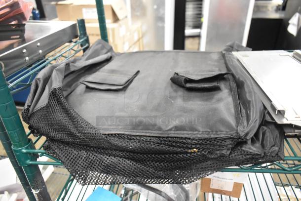 Lot including a black fabric hanging holder with mesh edges, visible in storage. Condition appears used.