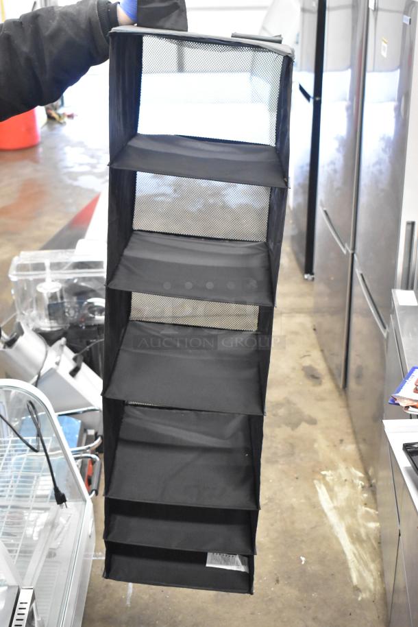 Lot of various items including a black mesh hanging holder, five compartments, good condition, suitable for storage.