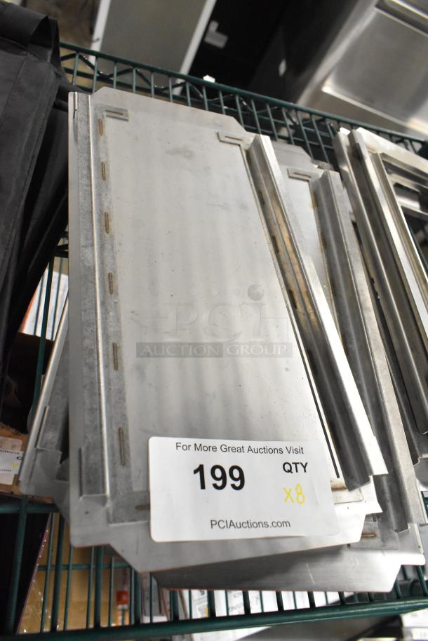 Eight metal pan lids, including 4 solid and 4 frame styles. Auction lot label indicates quantity of 8.