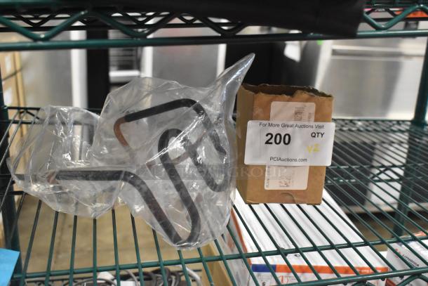 Brand new Vitamix 1152 Wet Blade Assembly and Turbo Air Refrigeration CONLOOP2848 Condensate Loop, shown in packaging.