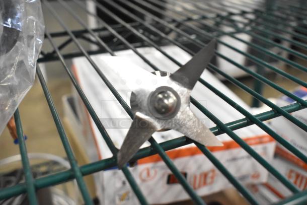 New Vitamix 1152 Wet Blade Assembly for standard containers on a shelf. Image shows the sharp stainless steel blades.