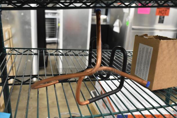 2 Brand new scratch and dent condensate loops on a metal rack, boxed with visible label text.