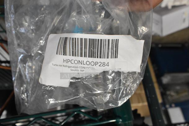 Packaged Turbo Air Refrigeration CONLOOP284 Condensate Loop, new condition, label with barcode visible.