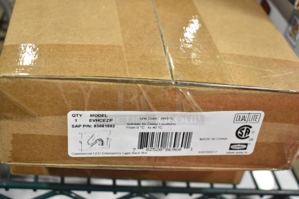 Box labeled DualLite EVHCEZP LED Emergency Light Back Box, suitable for damp locations, model new with potential minor dents.