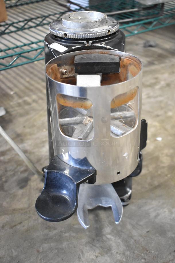 Magister M MD LA commercial espresso grinder base, no hopper. 115V, 1 phase. Black and silver, signs of use visible.