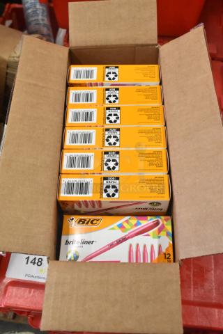 Case containing 7 boxes of BIC Brite Liner Highlighters, each box with 12 pink highlighters, new condition, visible barcodes.