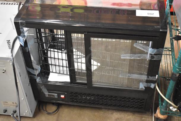 Brand new KoolMore CDC-3C-BK countertop display fridge, 3.6 Cu Ft, 115V, with minor scratches. Tags indicate model and specs.