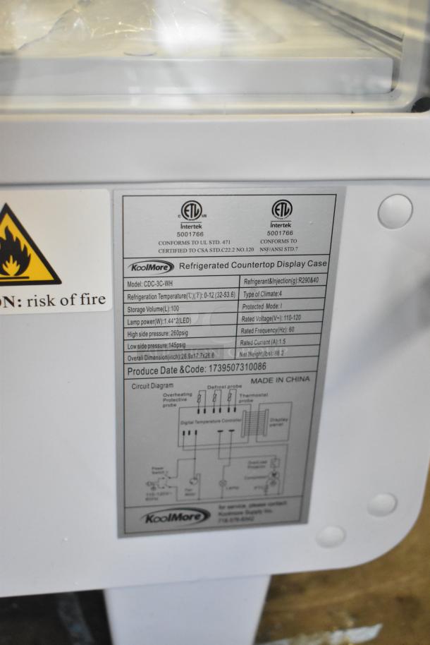 Brand new KoolMore CDC-3C-WH countertop display refrigerator, 3.6 Cu Ft, 110-120V, with markings indicating certification and specifications.