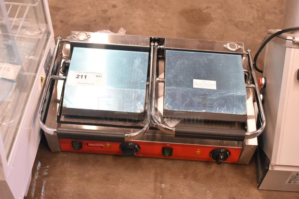 Brand new Avantco 177PG400GS dual panini grill; grooved top, smooth bottom, 19 5/8" x 9 1/8" surface, 120V, minor scratches.