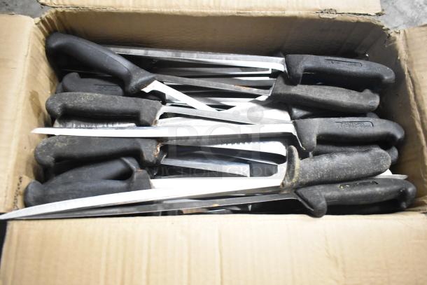 Box of 120 sharpened stainless steel knives with black handles, including a fillet knife. Knives lie inside a cardboard box.