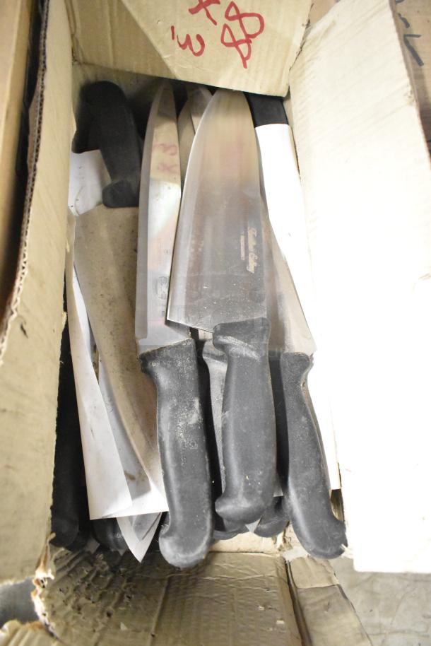 Box of 80 sharpened stainless steel knives, including chef knives, black handles, visible brand markings, good condition.