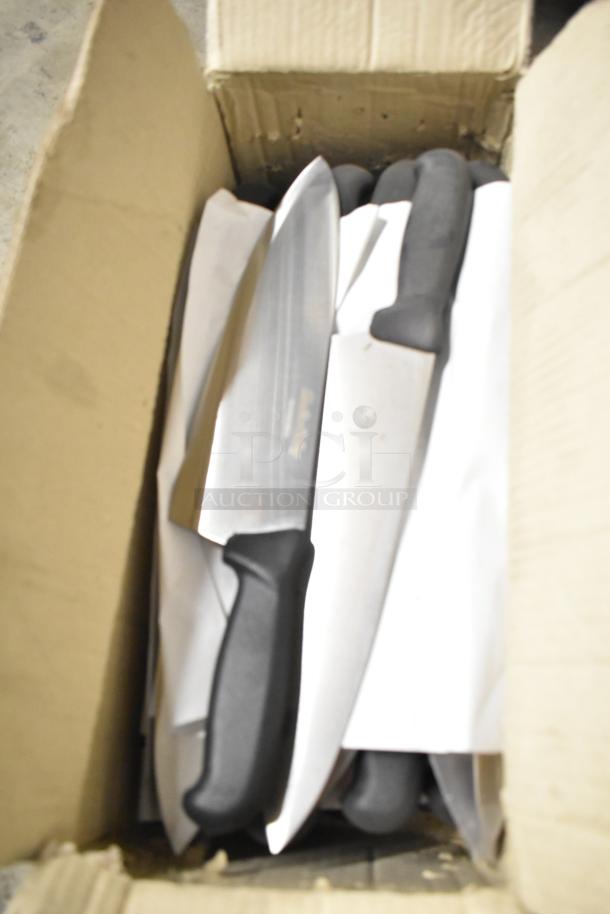 Box of 80 sharpened stainless steel knives, including chef knife, with black handles. Knives appear new and ready for use.