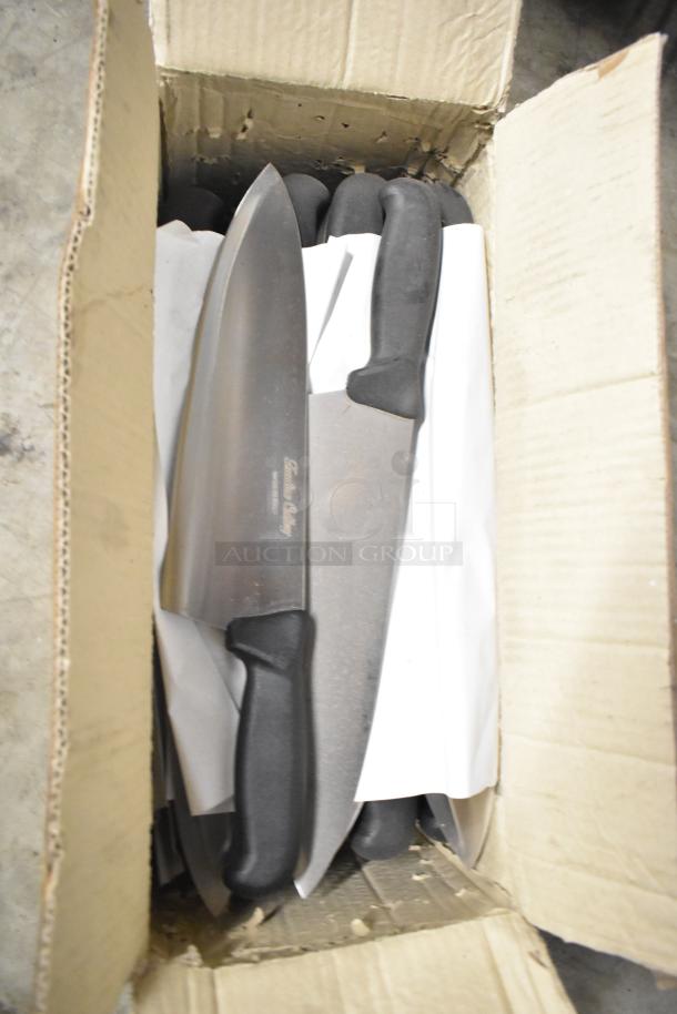 Box of 80 sharpened stainless steel knives, featuring chef knives, in good condition. Black handles and visible brand marking on blades.