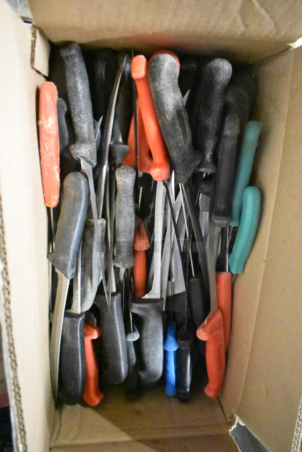 Box of 180 SHARPENED stainless steel knives, including chef, filet, and poultry knives, with assorted handle colors.