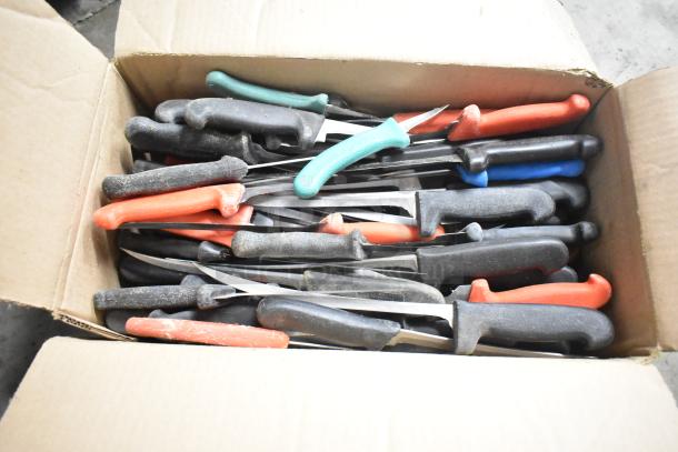 Box of 180 sharpened stainless steel knives with varied handles, including chef, filet, and poultry knives.