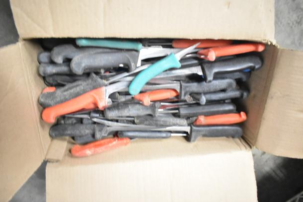 Box of 180 sharpened stainless steel knives with varied colored handles, including chef, filet, and poultry knives.