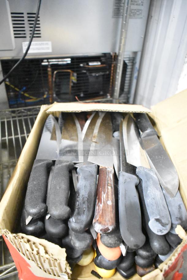 Box of 180 sharpened stainless steel knives, including chef, filet, and poultry knives, various handles, excellent condition.