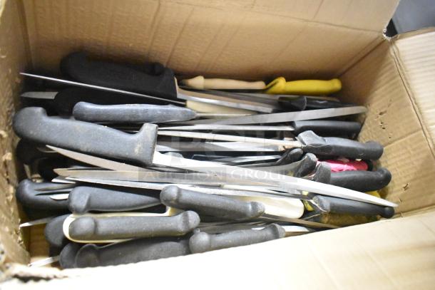 Cardboard box containing 60 sharpened stainless steel knives with black, yellow, and red handles, including filet knife.