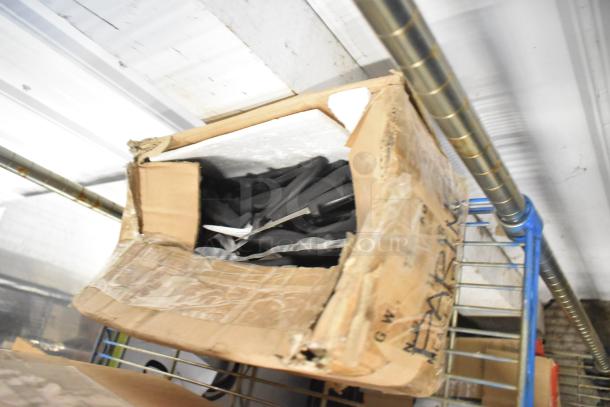 Box containing 58 sharpened stainless steel items, including pizza cutters and paring knives, with visible wear on packaging.