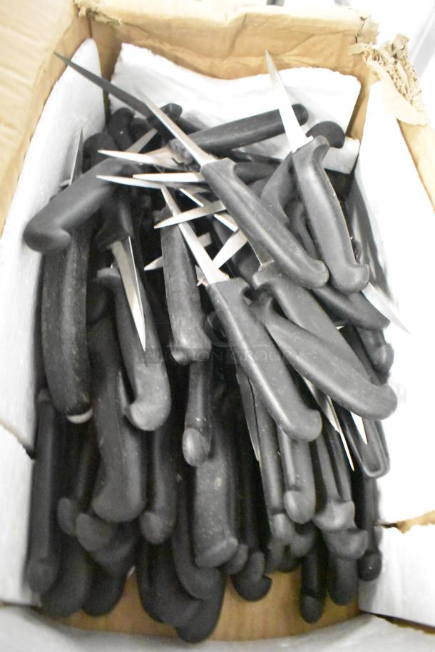 Box of 58 sharpened stainless steel items, including pizza cutters, dough cutter, and paring knives, with black handles.