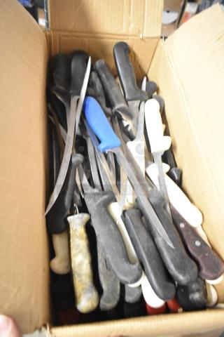 Box of 200 sharpened stainless steel knives, including filet, serrated, and rocking cutter. Black and white handles.