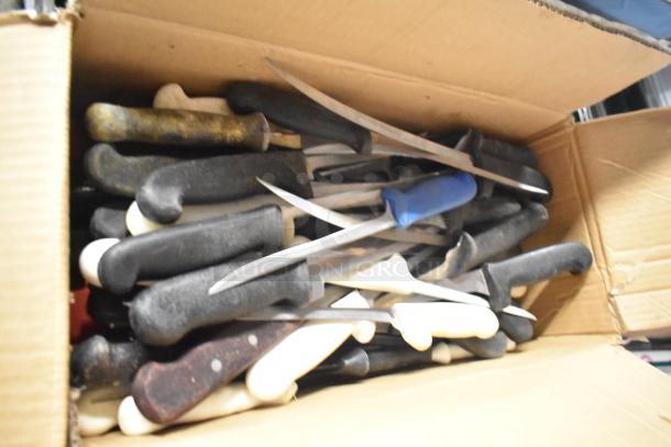 Box of 200 sharpened stainless steel knives, including filet, serrated, and rocking cutter, with varied handle colors.
