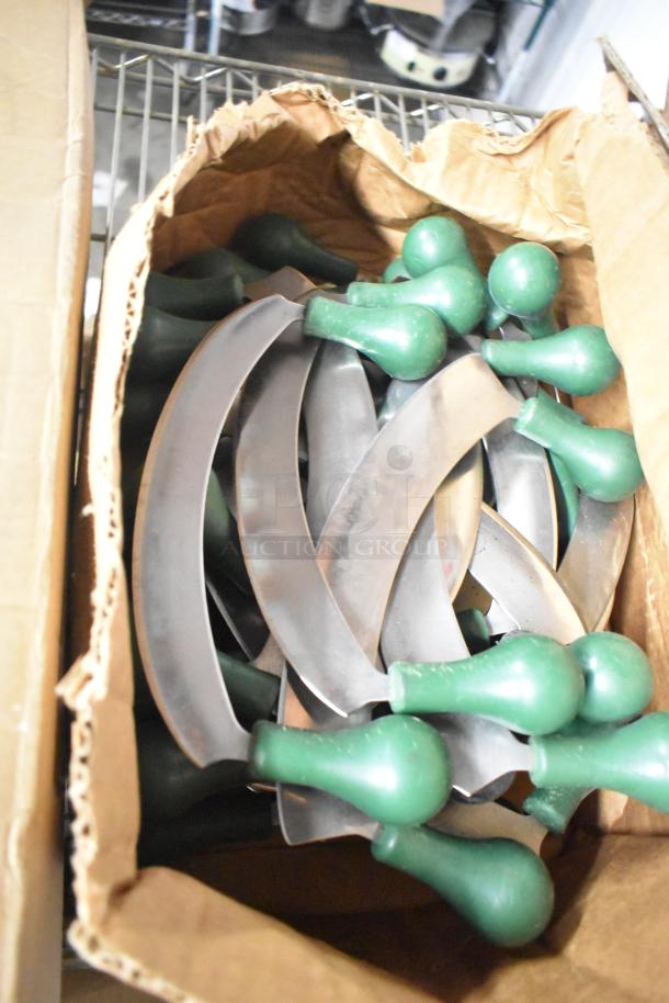 Box of stainless steel rocking cutter knives with green handles, sharpened, in bulk condition.