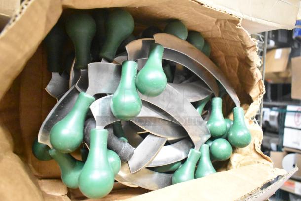 Box of assorted sharpened stainless steel knives with green handles, including filet and rocking cutter.