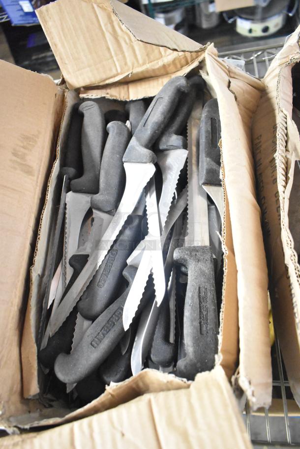 Box of 200 sharpened stainless steel knives including filet, serrated, and rocking cutter. Black handles, new condition.