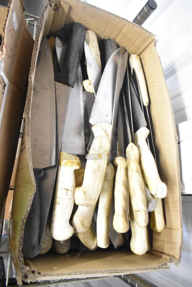 Box of 180 sharpened stainless steel knives, including chef and serrated types, with various handle conditions.