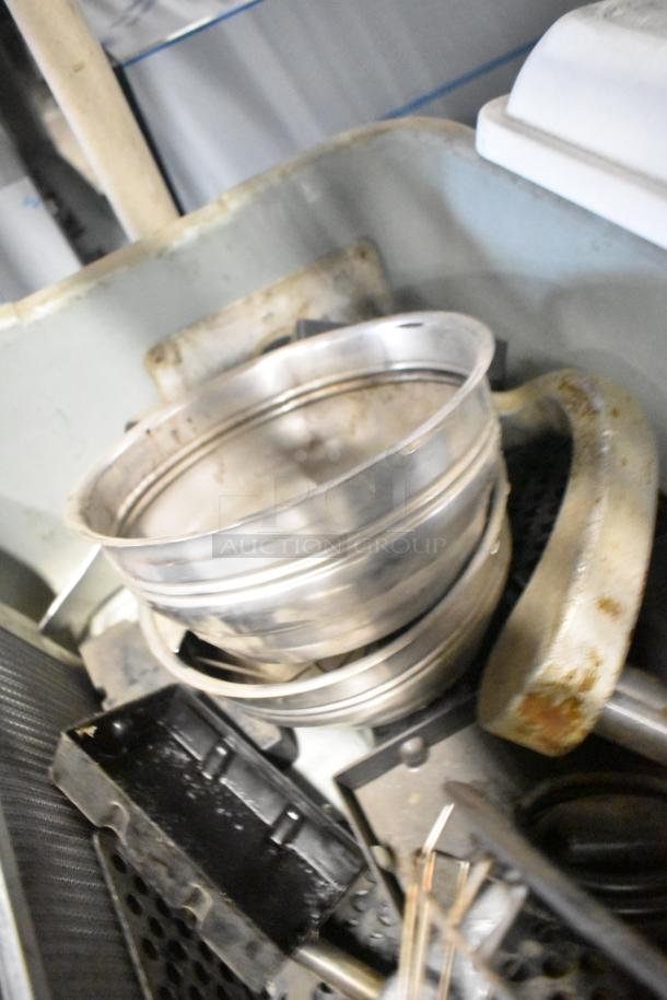 Lot of miscellaneous items including stainless steel brew baskets and black drip trays, varied condition.