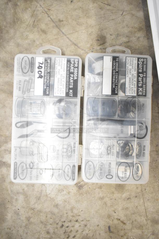 Assortment of parts labeled as "SPR 5000A Spare Parts Kit". Includes components for EZ Basis Systems. In plastic cases.