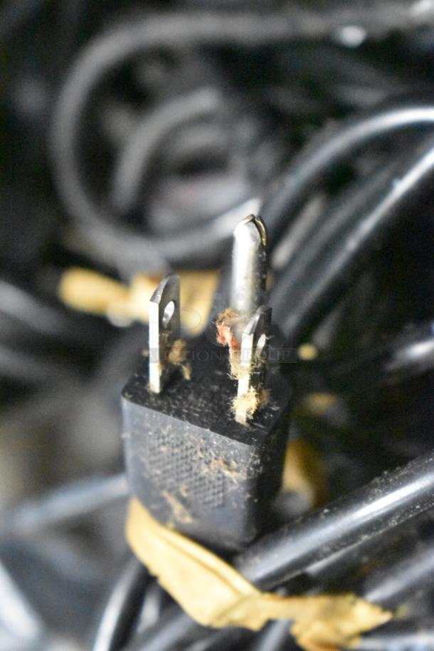 Bundle of assorted items including power cord with frayed plug. Potential for repair. Includes brew baskets, drip trays.