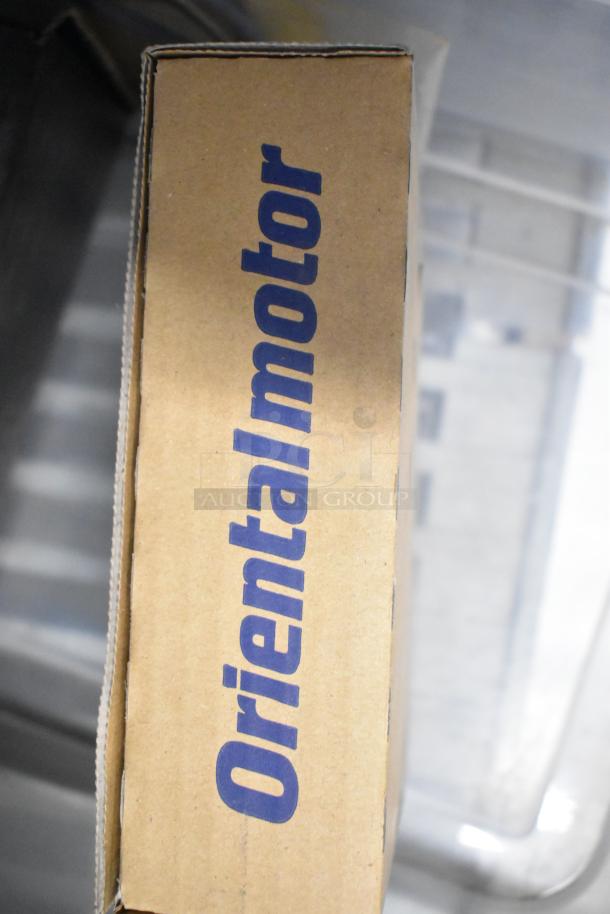 Cardboard box with "Oriental Motor" branded label, part of a tier lot including brew baskets and drip trays.