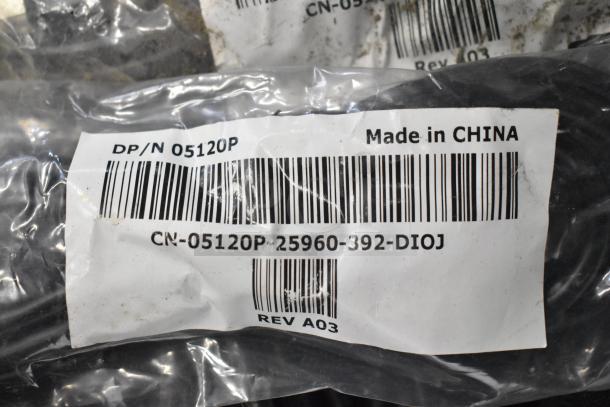Clear plastic packaging labeled "DP/N 05120P, Made in China," showing items from a tier lot including brew baskets and drip trays.