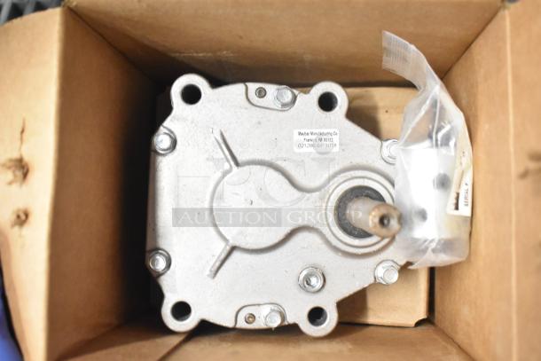 Taylor Gear Reducer in original packaging, features metal casing, visible shaft. Label: Maybar Manufacturing Co., Franklin, IN. Serial details included.