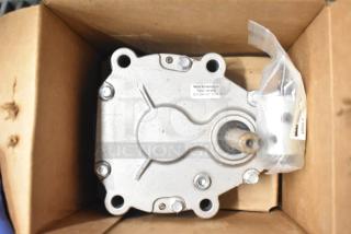 Taylor Gear Reducer in original packaging, features metal casing, visible shaft. Label: Maybar Manufacturing Co., Franklin, IN. Serial details included.