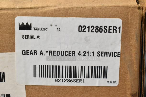 Box with Taylor Gear Reducer label, serial 021286SER1, ratio 4.21:1, indicating a service part.