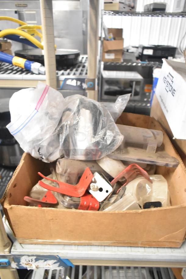 Cardboard box with assorted parts including Flavor Burst components, Turbochef kickplate, and ballasts. Various conditions.