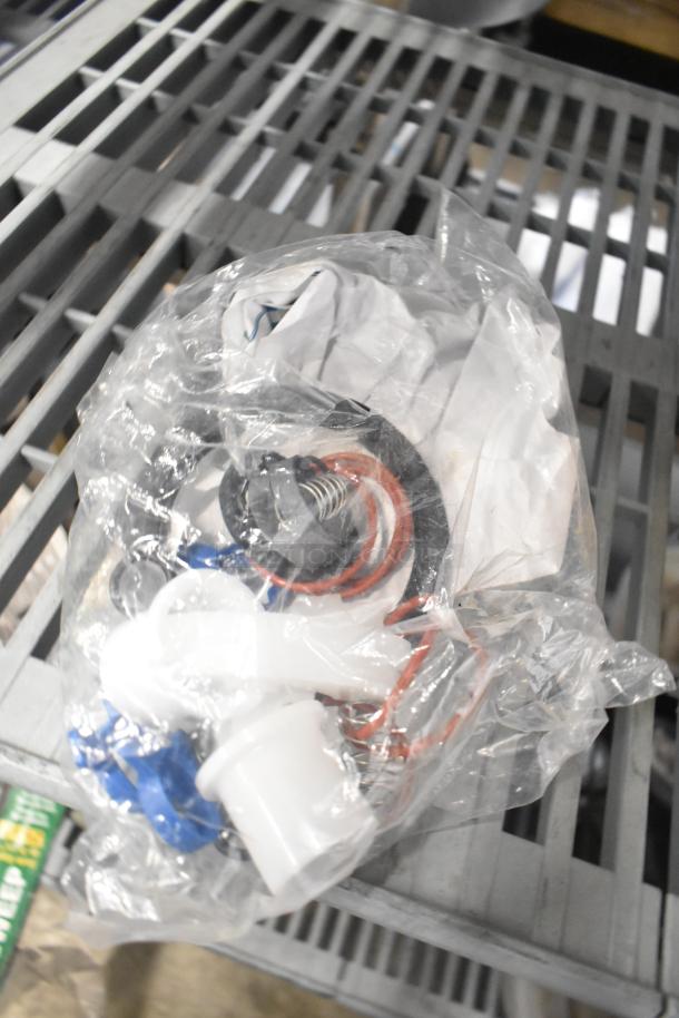 Assorted lot with Flavor Burst parts, Turbochef kickplate, and ballasts in plastic bag, new. Suitable for replacement needs.