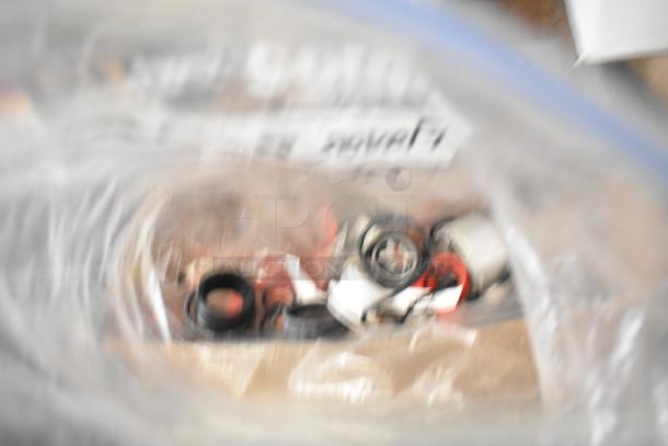 Bulk lot with Flavor Burst parts, drop-in bin, Turbochef kickplate, and ballasts in mixed condition. Blurred bag label.