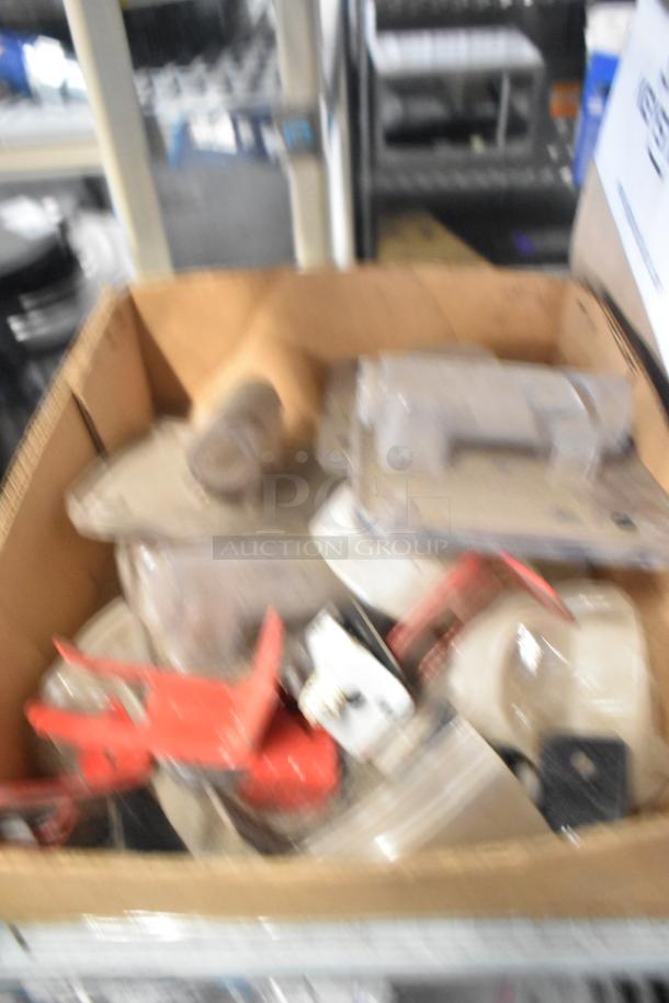 Box of assorted parts including Flavor Burst components, Turbochef kickplate, and ballasts, in used condition.