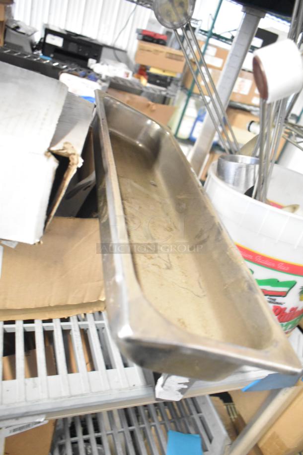 Auction lot including various items like Flavor Burst parts, Turbochef kickplate, and ballasts, shown in mixed condition.