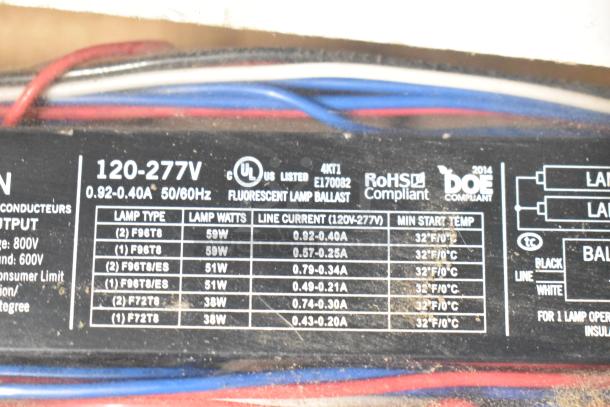 Fluorescent lamp ballast label showing voltage 120-277V, UL listed, RoHS compliant, and various lamp specifications.