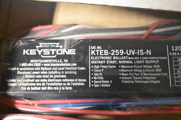 Keystone electronic ballast KTEB-259-UV-IS-N, labeled for instant start, high power factor, includes specifications and grounding instructions.