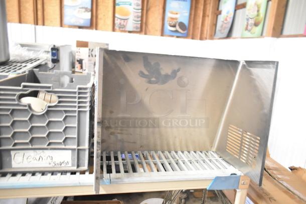 ALL ONE MONEY! Tier lot featuring various items, including a mixing cup collar and fluorescent sockets. Visible labels indicate cleaning supplies.